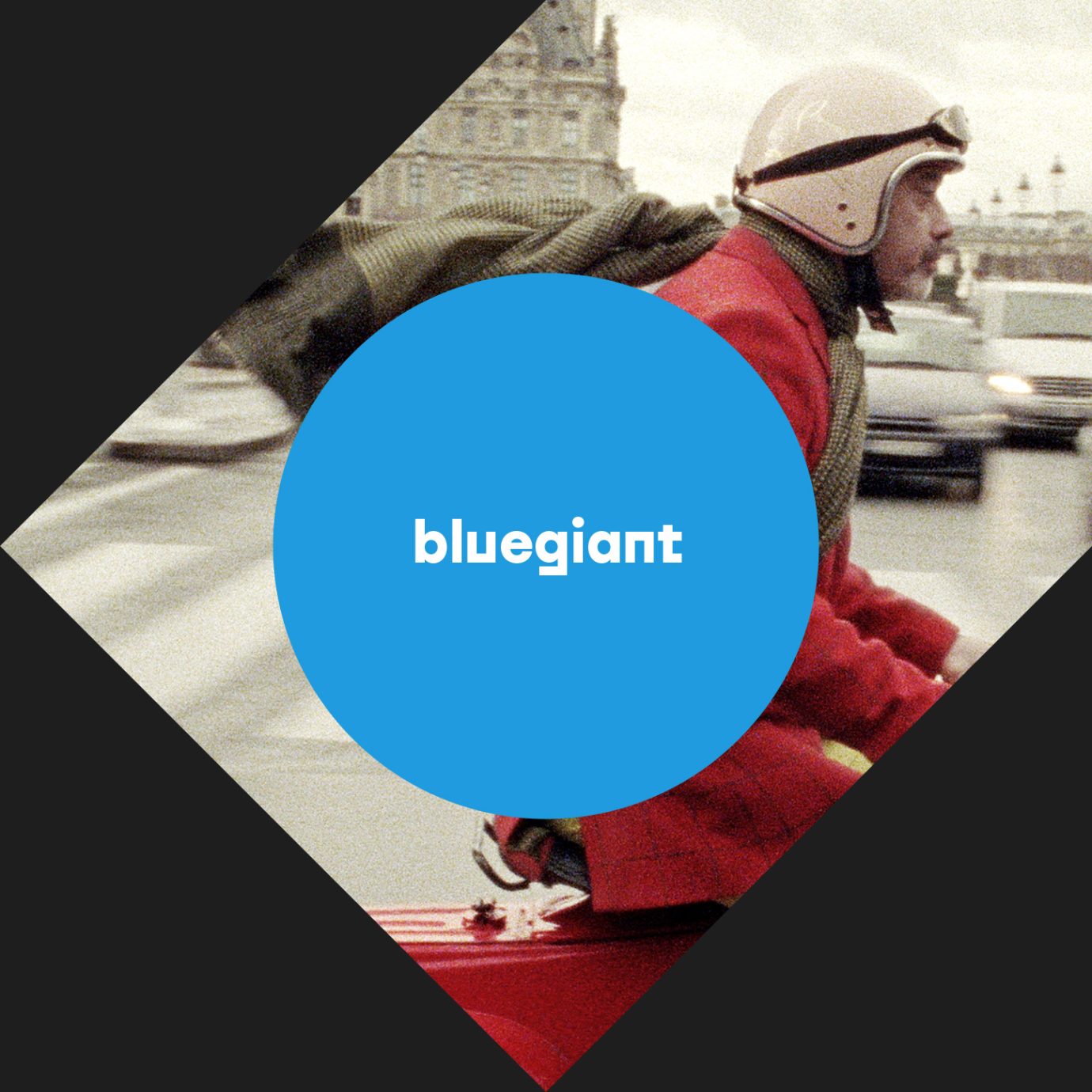 louboutin on a vespa behind the bluegiant logo