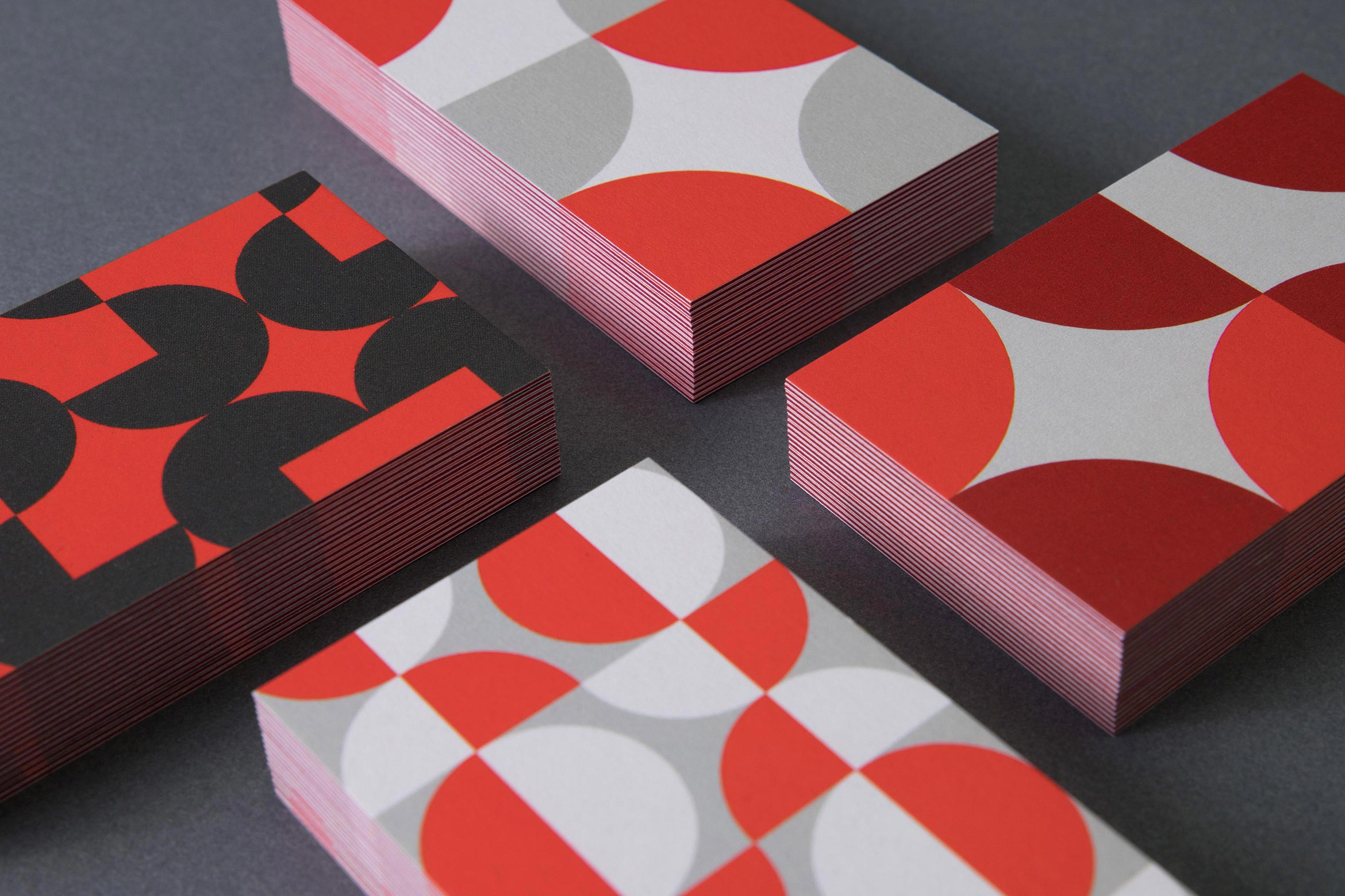 closeup of 4 business card designs using quarter and half circles