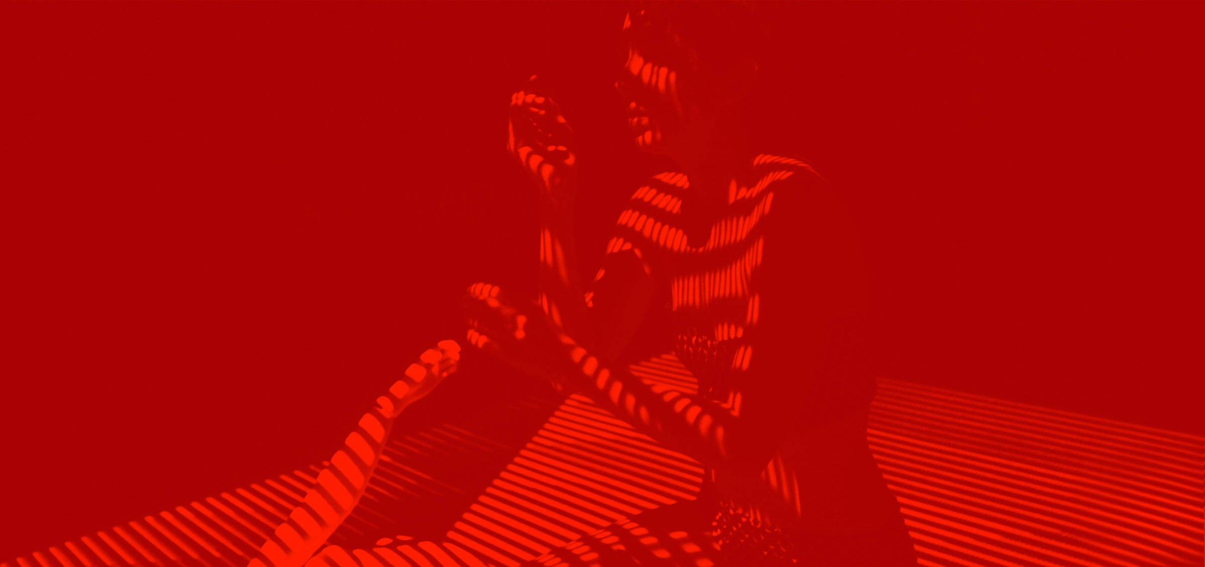 red overlay woman by window blinds soren west hero image