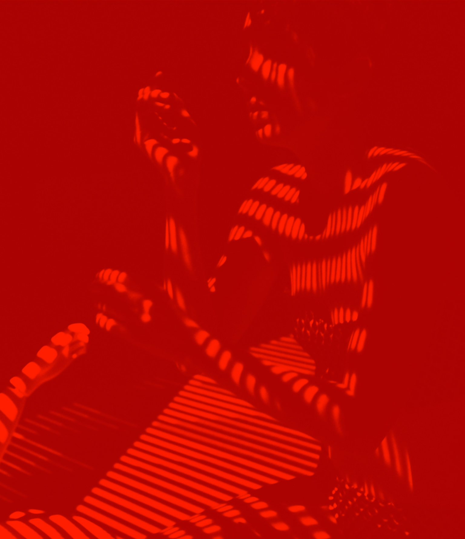 red overlay woman by window blinds soren west hero image
